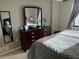 Bedroom featuring a comfortable queen-sized bed, with views from the window and a dresser at 701 S Madison Ave # 515, Clearwater, FL 33756