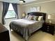 Relaxing bedroom featuring a comfortable queen-sized bed, nightstands, and soft lighting at 701 S Madison Ave # 515, Clearwater, FL 33756