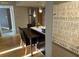 The dining area includes seating for four, pendant lighting, and beach themed decor at 701 S Madison Ave # 515, Clearwater, FL 33756