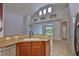 Kitchen peninsula featuring bar seating and sink overlooking the living room at 7114 Cromwell Park Ln, Apollo Beach, FL 33572