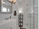 Bright bathroom featuring a glass shower enclosure with a modern sink and countertop space at 719 58Th S St, Gulfport, FL 33707