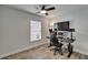 Bedroom with a gaming setup, desk, mounted monitor, and wood look flooring at 719 58Th S St, Gulfport, FL 33707