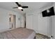 Bedroom with neutral colors, wood look floors, an ensuite bathroom, and ample closet space at 719 58Th S St, Gulfport, FL 33707