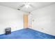 Bright bedroom features a ceiling fan, and a door leading to another room at 7444 119Th Ave, Largo, FL 33773
