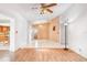 Spacious living area with a ceiling fan, tile flooring, and light-colored walls at 7444 119Th Ave, Largo, FL 33773