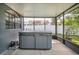 Sunroom with a hot tub and open view of the fenced backyard at 7444 119Th Ave, Largo, FL 33773