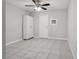 Bedroom featuring a ceiling fan and tiled floors at 7503 Winchester Dr, Tampa, FL 33615