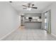 Open dining area features tile flooring with kitchen and sliding glass door in the background at 7503 Winchester Dr, Tampa, FL 33615