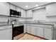 Well-maintained kitchen with stainless steel appliances, tile backsplash, and granite countertops at 7503 Winchester Dr, Tampa, FL 33615