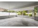 Spacious screened lanai with decorative tiled floor and a view of the landscaped backyard at 7503 Winchester Dr, Tampa, FL 33615