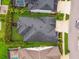 Birds eye view of the house, well-maintained lawn and lush tropical landscaping, plus a neighborhood overview at 7616 Paradiso Dr, Apollo Beach, FL 33572