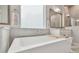 Modern bathroom featuring a standalone tub, stylish fixtures, and a bright, airy atmosphere at 7616 Paradiso Dr, Apollo Beach, FL 33572