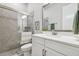 Modern bathroom featuring glass enclosed shower, a vanity with white countertops, and brushed nickel fixtures at 7616 Paradiso Dr, Apollo Beach, FL 33572