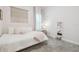 Cozy bedroom featuring neutral walls, large bed, and an accent mirror at 7616 Paradiso Dr, Apollo Beach, FL 33572