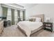 A serene bedroom with neutral tones, offering a cozy and relaxing space to unwind at 7616 Paradiso Dr, Apollo Beach, FL 33572