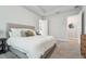 Inviting bedroom with a cozy bed, walk-in closet, and neutral decor, creating a serene retreat at 7616 Paradiso Dr, Apollo Beach, FL 33572