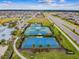 The community features tennis and basketball courts for recreational activities and enjoyment at 7616 Paradiso Dr, Apollo Beach, FL 33572