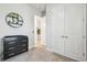 Hallway including white doors, a modern changing table, and neutral decor at 7616 Paradiso Dr, Apollo Beach, FL 33572