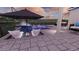Patio of backyard pool features furniture and umbrellas with views of the yard at 7616 Paradiso Dr, Apollo Beach, FL 33572