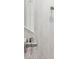 Close-up of an elegant shower with tiled walls, modern fixtures, and built-in shelving at 7616 Paradiso Dr, Apollo Beach, FL 33572