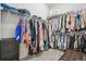Spacious walk-in closet featuring ample shelving and hanging storage for clothes, shoes, and accessories at 7616 Paradiso Dr, Apollo Beach, FL 33572