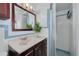 Bathroom featuring vanity with granite countertop, and glass door shower stall at 8014 Lotus Dr, Port Richey, FL 34668
