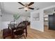 Dining room with a wooden table set and view to the living room and kitchen at 8014 Lotus Dr, Port Richey, FL 34668
