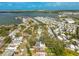 An aerial view showcases a waterfront community with numerous boat slips and stunning views of the surrounding bay at 8335 42Nd N Ave, St Petersburg, FL 33709