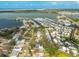 An aerial view showcases a waterfront community with numerous boat slips and stunning views of the surrounding bay at 8335 42Nd N Ave, St Petersburg, FL 33709