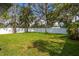 Spacious backyard featuring lush green grass and a white privacy fence, perfect for outdoor activities and relaxation at 8335 42Nd N Ave, St Petersburg, FL 33709