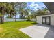 Lush backyard featuring a patio and surrounded by mature trees and fencing providing privacy at 8335 42Nd N Ave, St Petersburg, FL 33709