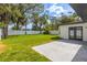 Large grassy backyard with a white fence offers privacy and space for outdoor activities at 8335 42Nd N Ave, St Petersburg, FL 33709