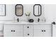 Bright bathroom with a double vanity featuring elegant mirrors and modern fixtures at 8335 42Nd N Ave, St Petersburg, FL 33709