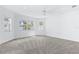Spacious bedroom with a ceiling fan, carpeted flooring, and multiple windows for natural light at 8335 42Nd N Ave, St Petersburg, FL 33709