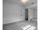 Sunlit bedroom with neutral carpet and sliding closet doors offers a peaceful retreat at 8335 42Nd N Ave, St Petersburg, FL 33709