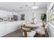Open floor plan featuring a modern dining room area with kitchen and island at 8335 42Nd N Ave, St Petersburg, FL 33709