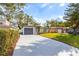 A single-Gathering home with a well-maintained lawn and driveway, complemented by lush landscaping and mature trees at 8335 42Nd N Ave, St Petersburg, FL 33709