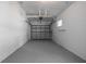 Clean, empty garage space, featuring a painted floor and walls, ready for parking or storage at 8335 42Nd N Ave, St Petersburg, FL 33709
