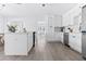 Modern white kitchen featuring stainless steel appliances, shaker cabinets and an open layout at 8335 42Nd N Ave, St Petersburg, FL 33709