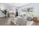 Bright and open living room with large windows, comfortable seating, and modern decor at 8335 42Nd N Ave, St Petersburg, FL 33709