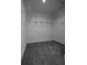 Walk-in closet with carpeted floors and wire shelving provides ample storage space at 8335 42Nd N Ave, St Petersburg, FL 33709