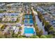 Aerial view showcases community pool, tennis courts, and surrounding homes, providing a sense of community at 9806 Bennington Dr, Tampa, FL 33626