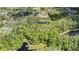 Aerial shot of a community park and nature trails with a small lake, perfect for outdoor recreation at 9806 Bennington Dr, Tampa, FL 33626