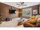 Cozy living room with a large window, plush sofa, and a 'Personal Cave' sign, creating a relaxing retreat at 9806 Bennington Dr, Tampa, FL 33626