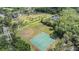 See the tennis court and playground in this lush park at 9806 Bennington Dr, Tampa, FL 33626