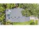 See the shingle roof and screened-in pool from above at 9806 Bennington Dr, Tampa, FL 33626
