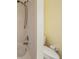 Classic bathroom with tiled walls, a tub and shower combo, and a modern toilet at 9806 Bennington Dr, Tampa, FL 33626