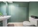 Powder room with pedestal sink, tile floors, and neutral walls offers a clean and simple design at 9806 Bennington Dr, Tampa, FL 33626