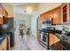 Eat-in kitchen with tile floors, stainless steel appliances, granite countertops and a breakfast nook at 9806 Bennington Dr, Tampa, FL 33626