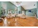 Open living room features high ceilings, hardwood floors, and large windows for natural light at 9806 Bennington Dr, Tampa, FL 33626